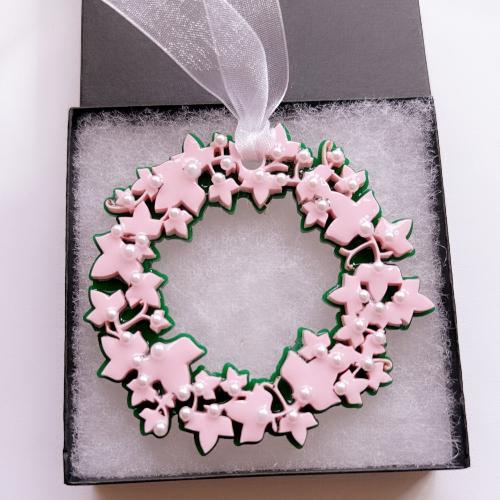 2024 Edition AKA Ivy Ornament featuring a two-layer pink and green acrylic design adorned with pearl embellishments. A perfect holiday keepsake celebrating Alpha Kappa Alpha Sorority, Inc., ideal for gift-giving or adding elegance to your decor.