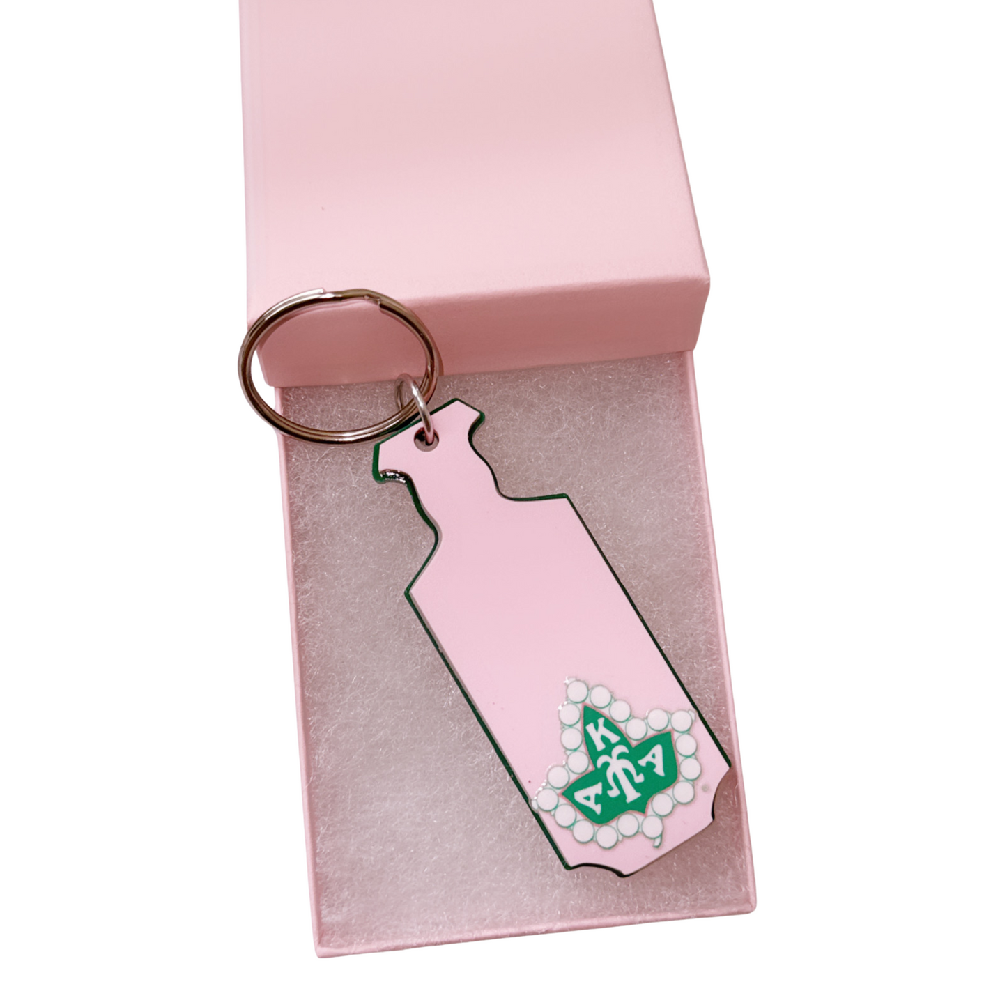 Pink keychain with a design on a pink box