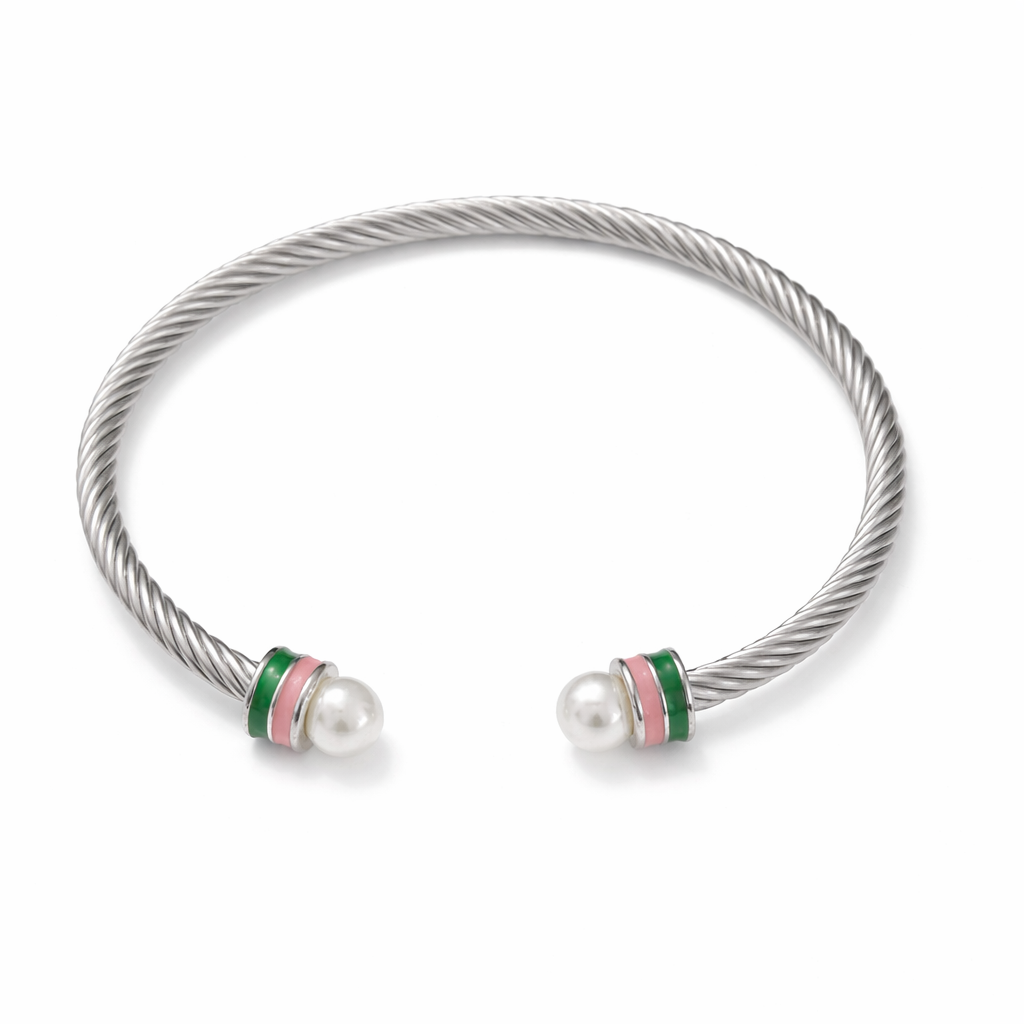 Open cuff stainless steel cable bracelet with pearl tips and pink and green accent bands on a white background