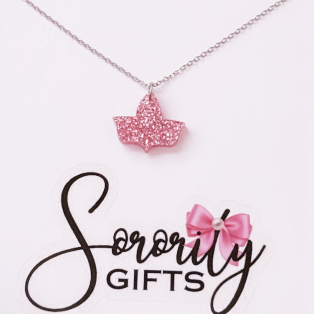 Pink glitter ivy leaf pendant necklace displayed on a white backing card with the "Sorority Gifts" logo featuring a pink bow.