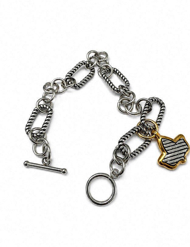 Stainless steel two tone ivy charm link bracelet with textured silver links, gold-tone ivy charm, and toggle clasp displayed on a white background.