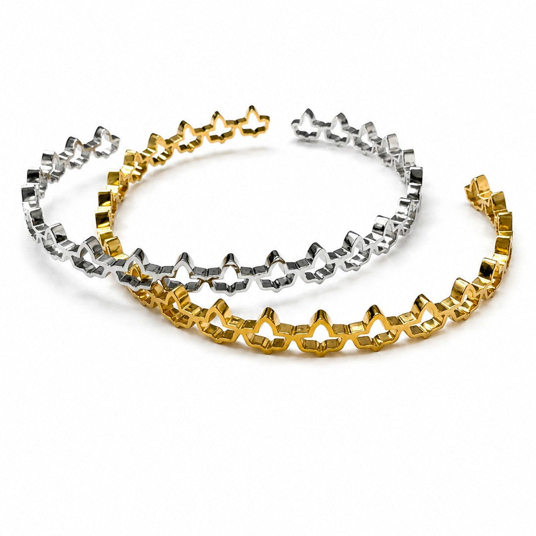 Adjustable stainless steel ivy cuff bracelets in gold and silver finishes with elegant ivy cutout design on a white background.
