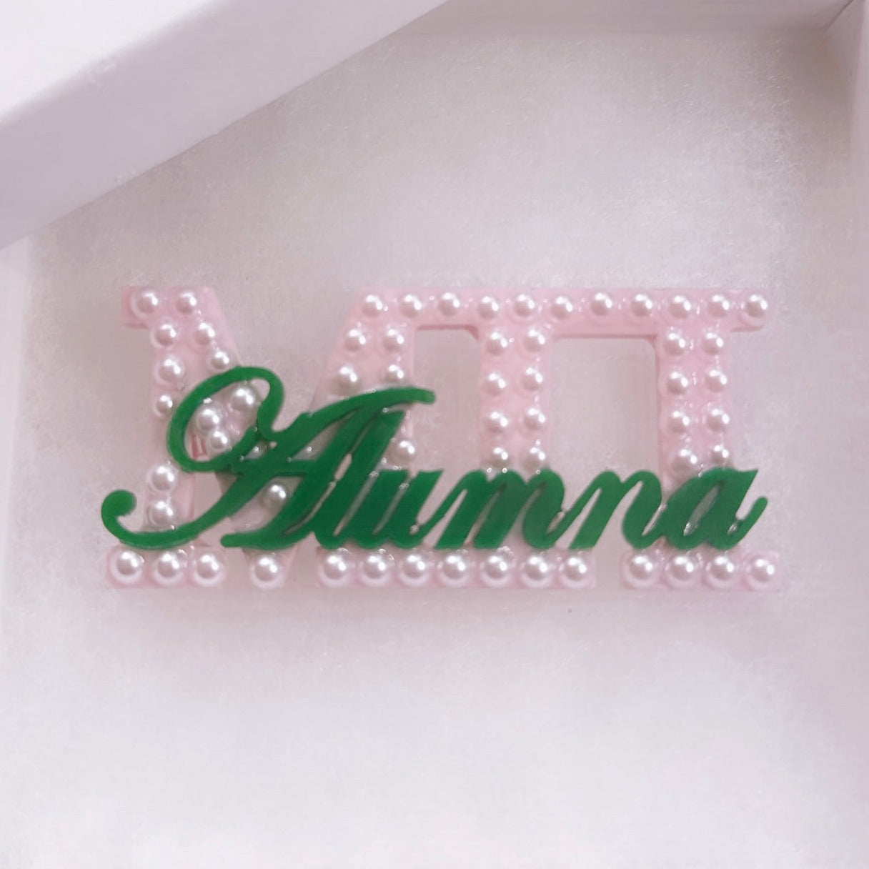 Acrylic Brooch bedazzled with pearls.