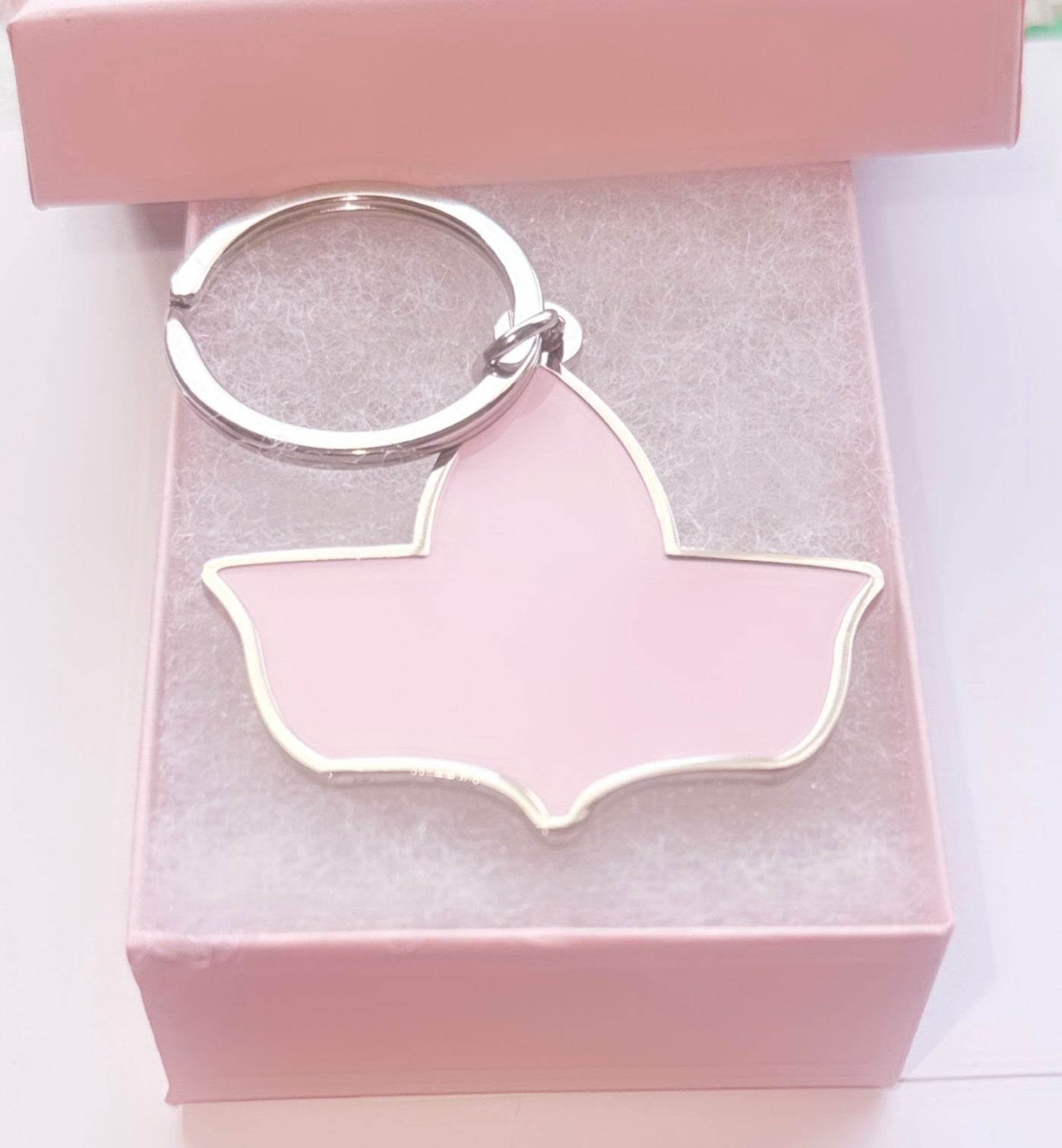 Pink enamel side of the double-sided keychain featuring the official Ivy Leaf logo of Alpha Kappa Alpha Sorority, Inc., presented in a soft pink gift box.