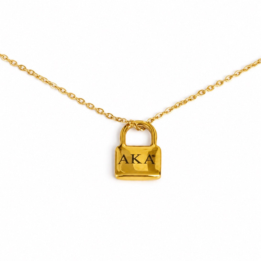 Gold tone AKA padlock pendant necklace with a polished finish and link chain on a white background.