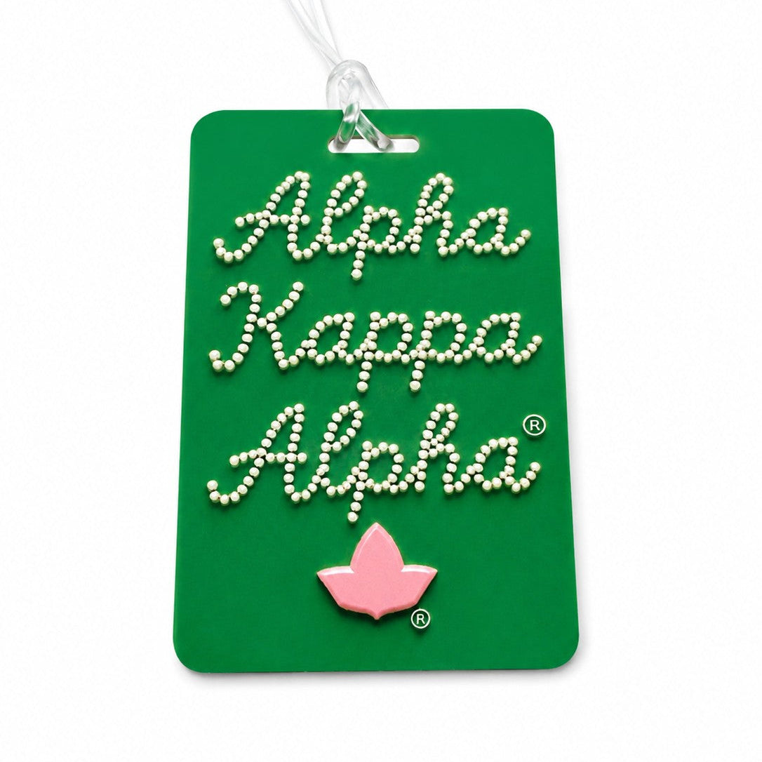 Personalized Alpha Kappa Alpha double sided purse and luggage tag in green featuring pearl script lettering, durable board construction, pink ivy emblem, and a clear flexible luggage strap.