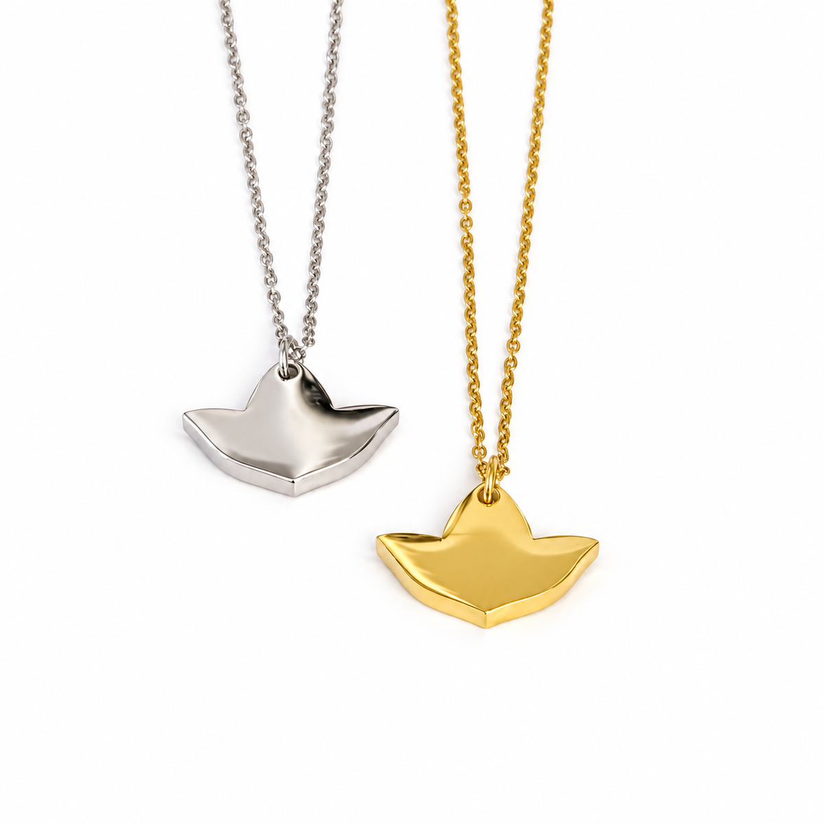 Silver and gold ivy leaf pendant necklaces displayed side by side on a white background.